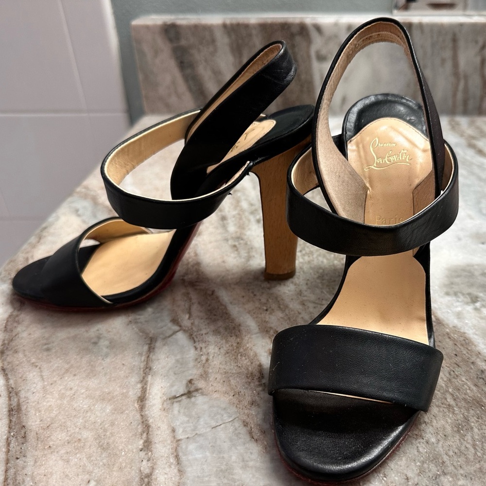 CHRISTIAN LOUBOUTIN
Etri Wood Leather Slingback Sandals